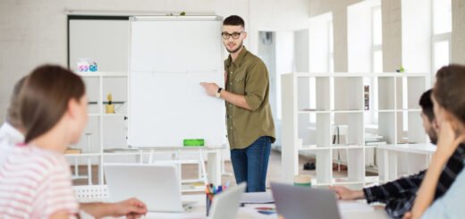 https://img.freepik.com/free-photo/young-businessman-eyeglasses-shirt-standing-near-board-while-thoughtfully-discussing-new-project-with-colleagues-group-people-working-together-modern-office_574295-5884.jpg?t=st=1737703505~exp=1737707105~hmac=fe13b228508614a132814cfe9cbbea182f6064cefa1b9351936d2d99d1958bca&w=740